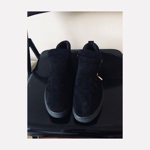 Black velvet ankle boots.